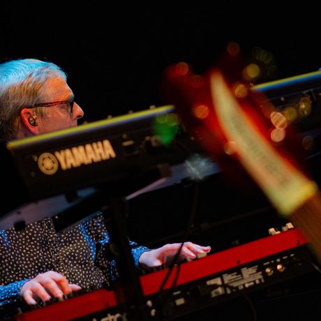 A person playing a Yamaha keyboard.