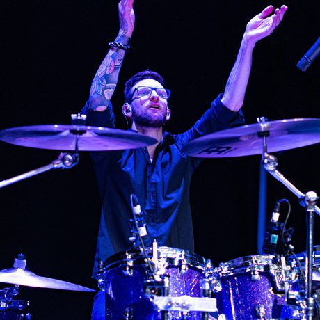 A person playing the drums.