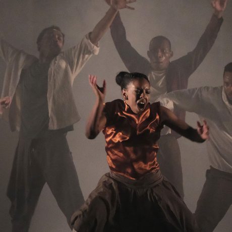 Dancers moving their bodies and arms.