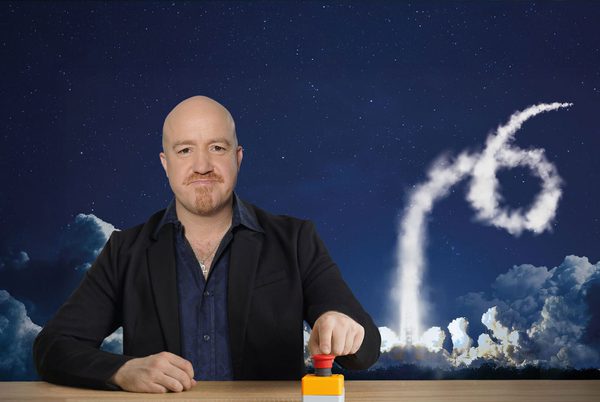 Andy Parsons pushing a red button.
