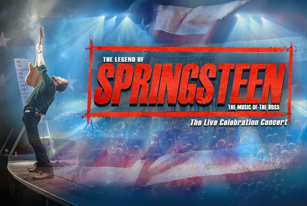 Text that reads 'The Legend of Springsteen'. A person holding up a guitar to a large crowd.