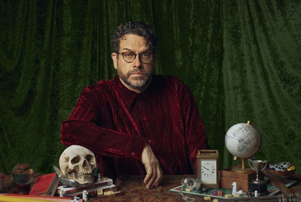 Michael Spicer sitting at a desk.