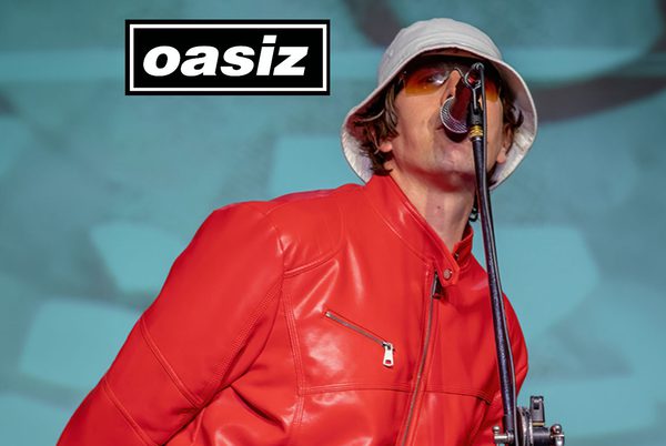 Performer in red singing into a mic.