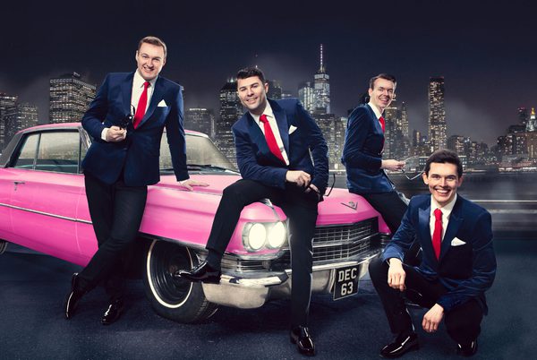 Four people in suits, sitting around a pink Cadillac.