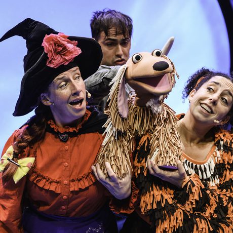 Performers with a puppet dog.