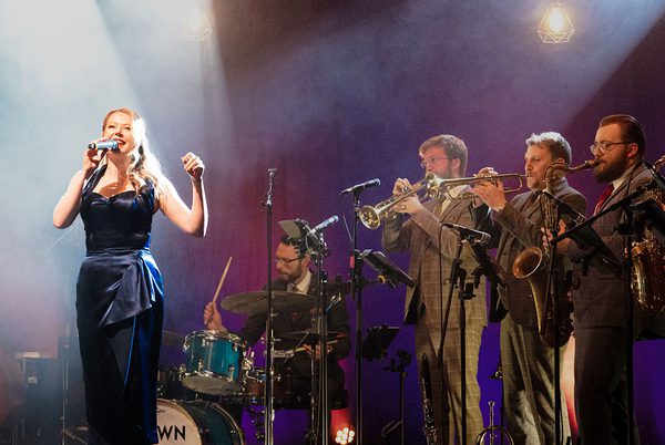 A swing band performing on stage.