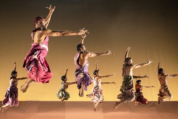 Dancing leaping into the air.