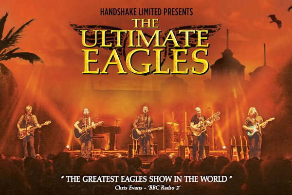 Text that reads 'The Ultimate Eagles'. A rock band playing on a large stage.
