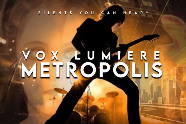 Text that reads 'Silents you can hear. Vox Lumiere Metropolis'. A silhouette of a person playing a guitar.