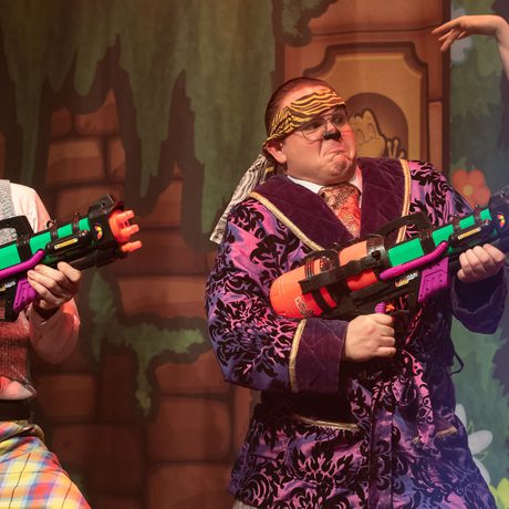 Two performers with water guns