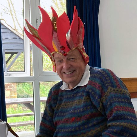 Participant wearing self-made headdress and smiling.