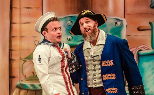 Two panto performers, one dressed as a pirate, the other a sailor.
