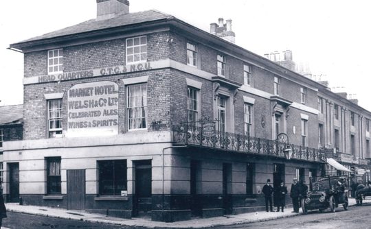 A black and white image of the Market Hotel from 1850-1912, now Theatre Royal Winchester.
