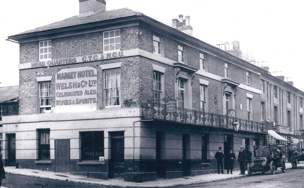 A black and white image of the Market Hotel from 1850-1912, now Theatre Royal Winchester.