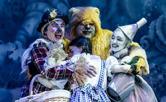 Panto characters, Dorothy, Scarecrow, Tin Man, Lion, all hugging