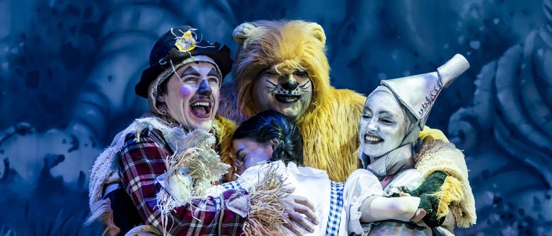 Panto characters, Dorothy, Scarecrow, Tin Man, Lion, all hugging