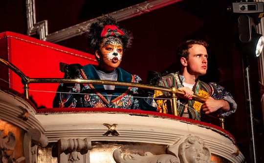 Puss and Colin panto performers sat in the box in Theatre Royal Winchester's auditorium.