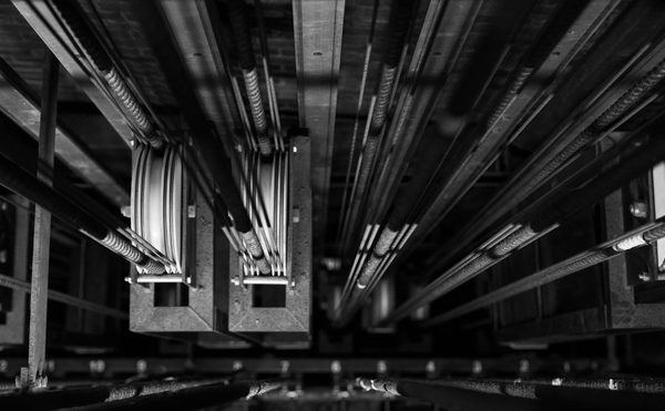 A black and white photo of the theatre's rigging/fly system.