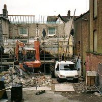 Old building torn down with scaffolding.