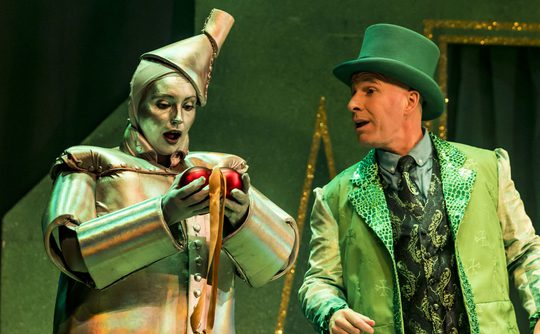 Panto performers, the Tin Man receiving a heart of the Wizard of Oz.