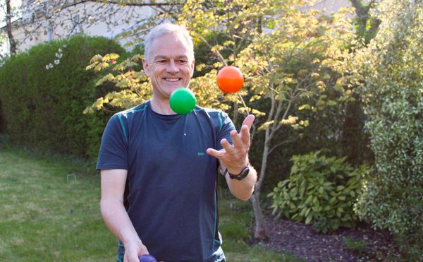 Deryck Newland, Chief Executive and Artistic Director, juggling coloured balls