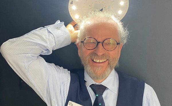 Desmond Webb, Head of Site Development, light blue shirt, navy waistcoat, navy tie, glasses