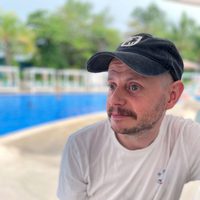 A person sitting by a pool