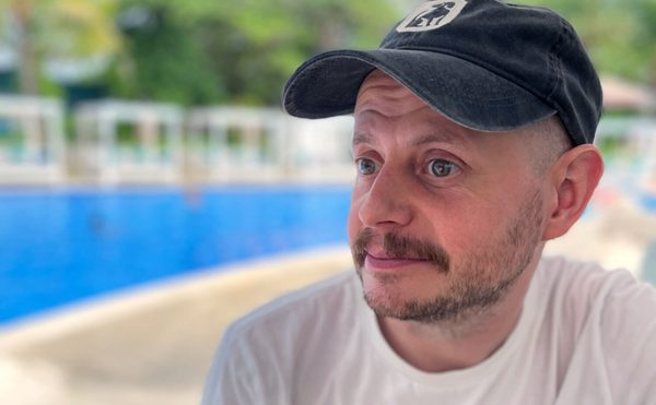 A person sitting by a pool